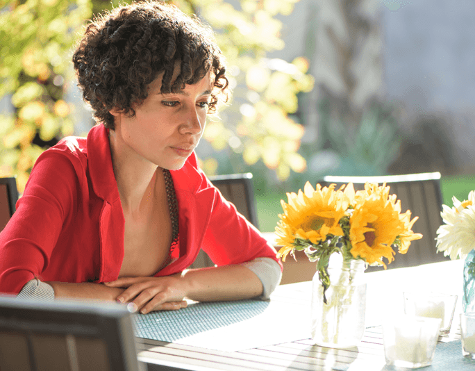 Anxious woman at table main